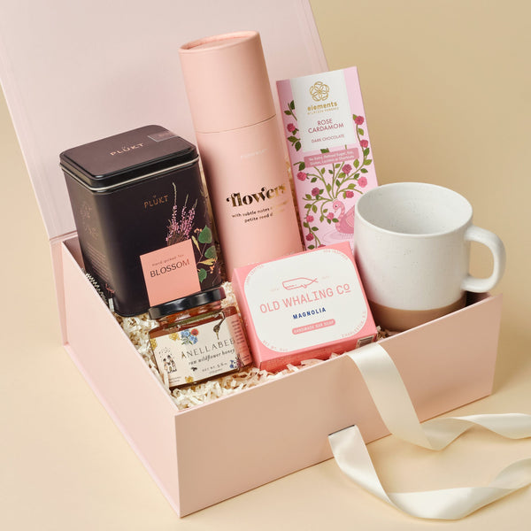 In Bloom floral self-care gift box with botanicals, honey, handcrafted mug, and chocolate in an Unboxme gift box