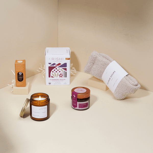 Get well soon gift box with honey, herbal tea, cozy socks, and essential oils in a blue Unboxme gift box