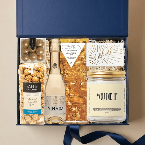 You Did It congratulations gift box with gourmet treats, alcohol-free bubbly, and celebratory candle in an Unboxme gift box