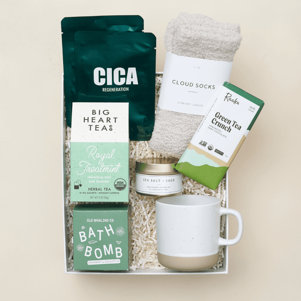 Royal Treatment luxury self-care gift box with sheet masks, bath bombs, candle, and treats in a blue Unboxme gift box