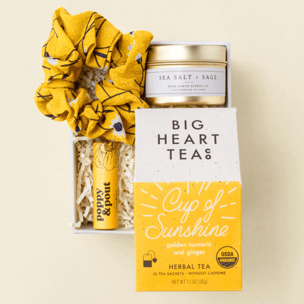 Shine Bright pick-me-up gift box with spiced teas, candle, and honey lip balm in a blue Unboxme gift box