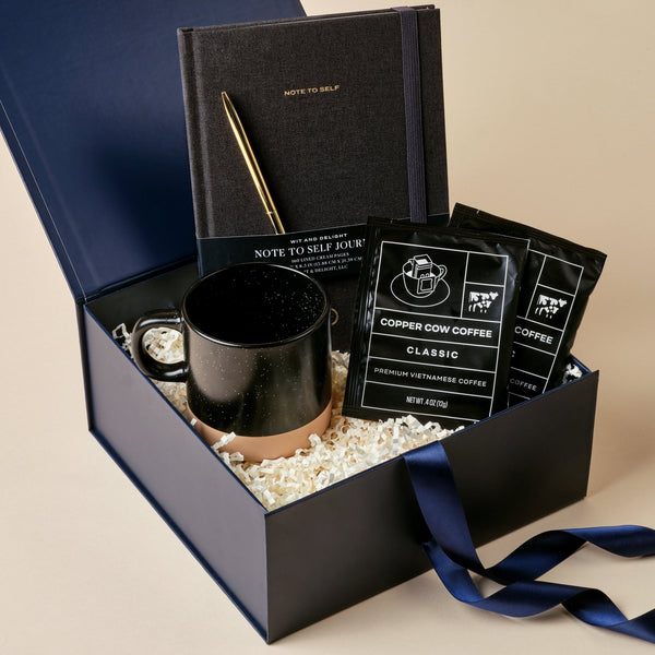 Note to Self journal gift box with black linen journal, gold pen, speckled mug, and pour-over coffee in a blue Unboxme gift box