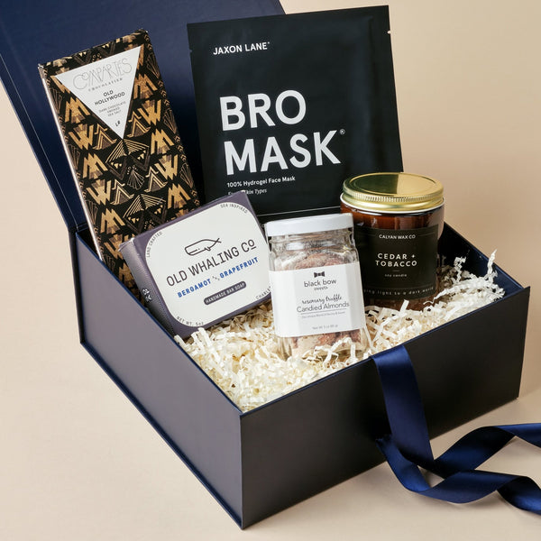 The Bro Box gift box for men with face mask, cedar candle, truffle almonds, and chocolate in an Unboxme gift box