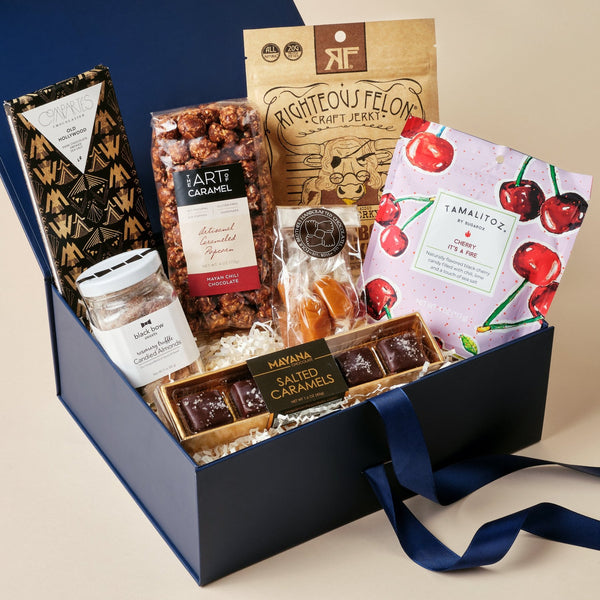 Sweet and Savory gourmet snack gift box with chocolate popcorn, caramels, truffle almonds, and beef jerky in an Unboxme gift box