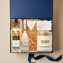You Did It congratulations gift box with gourmet treats, alcohol-free bubbly, and celebratory candle in an Unboxme gift box