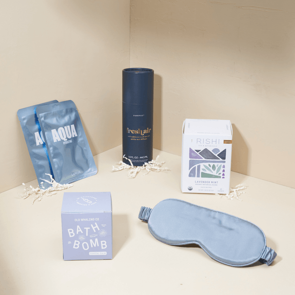 Zen relaxation gift box with candle, herbal tea, silk eye mask, and self-care essentials in a white Unboxme gift box